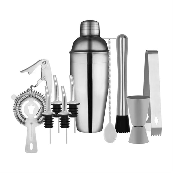 A collection of cocktail making tools including a shaker, jiggers, a cocktail spoon, muddler, ice tongs, and bottle pourers.