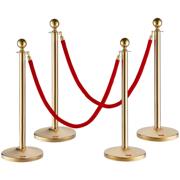 A set of gold stanchion posts with red velvet ropes arranged to form a barrier