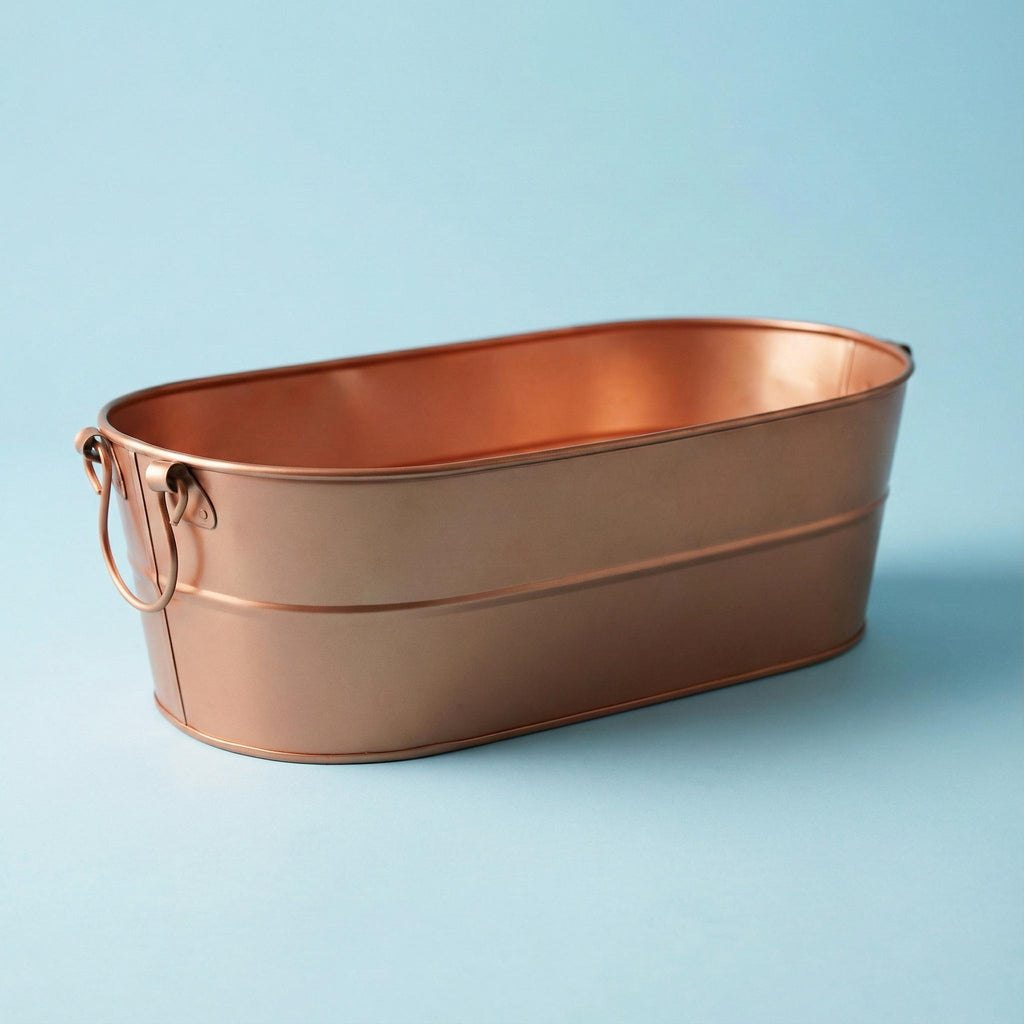Copper drinks tub on a light blue background