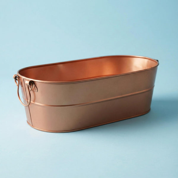 Copper drinks tub on a light blue background