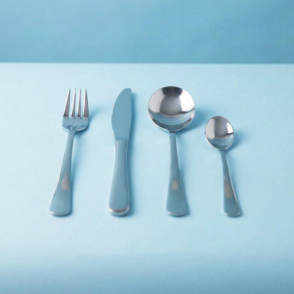 Set of silver cutlery with blue handles on a light blue background