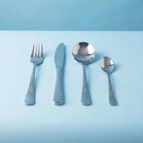Set of silver cutlery with blue handles on a light blue background