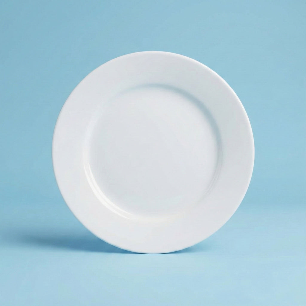 White dinner plate on a light blue background