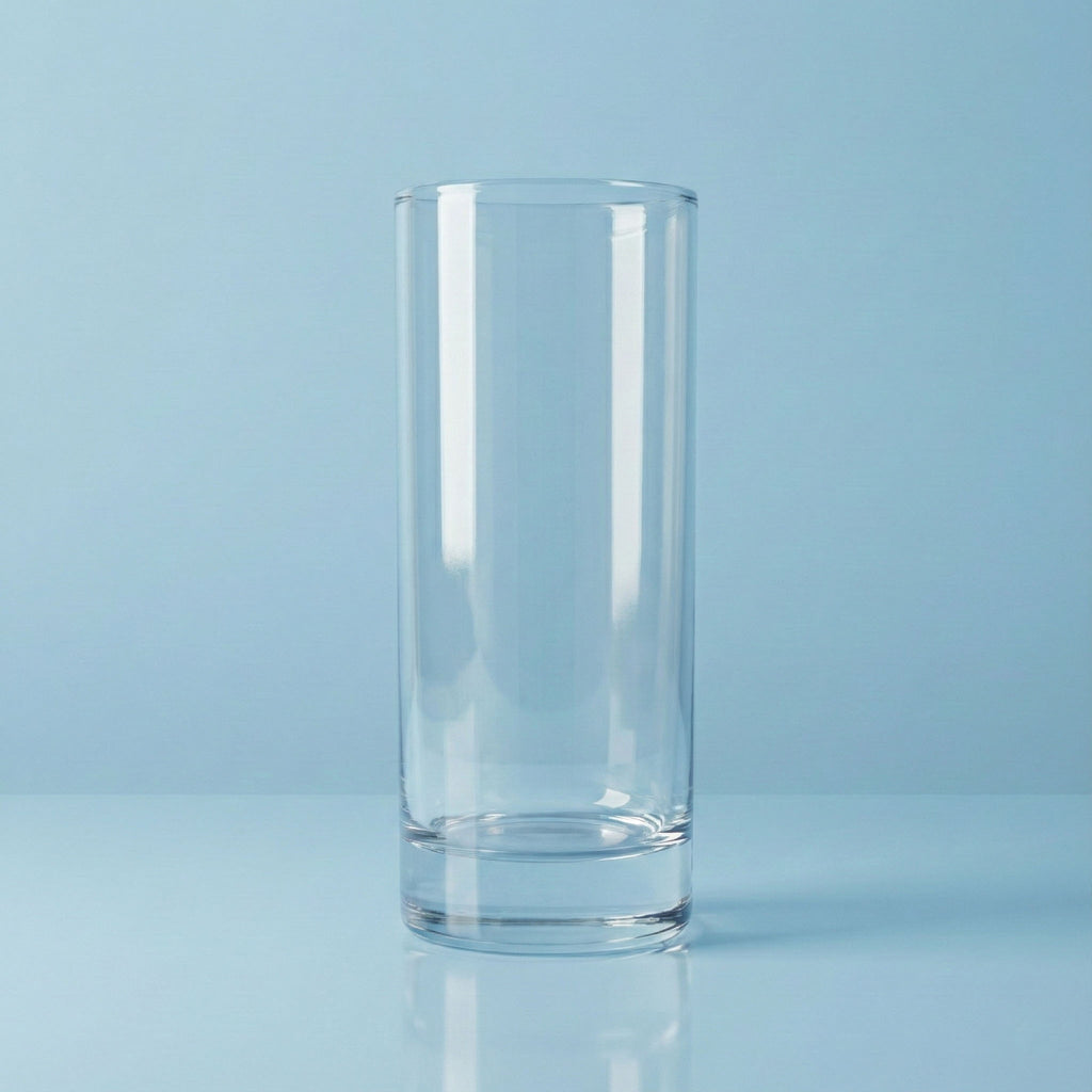 Clear hiball tall glass on a light blue background
