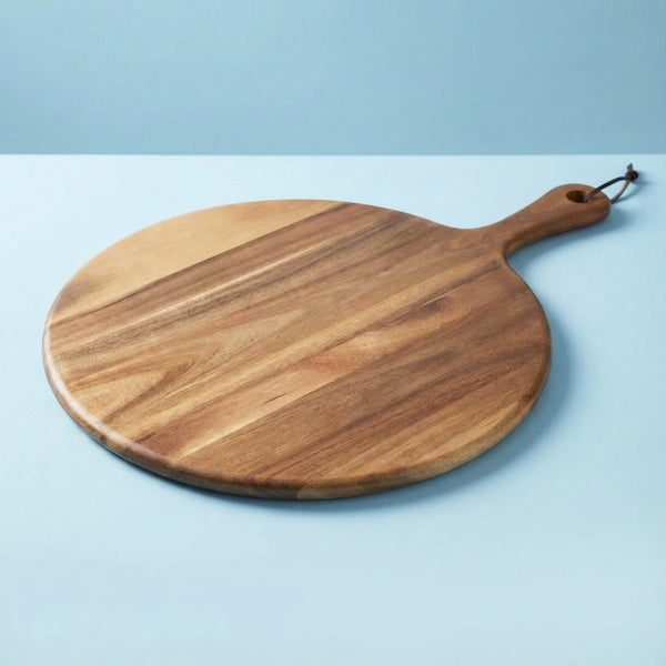 Wooden serving board on a light blue background